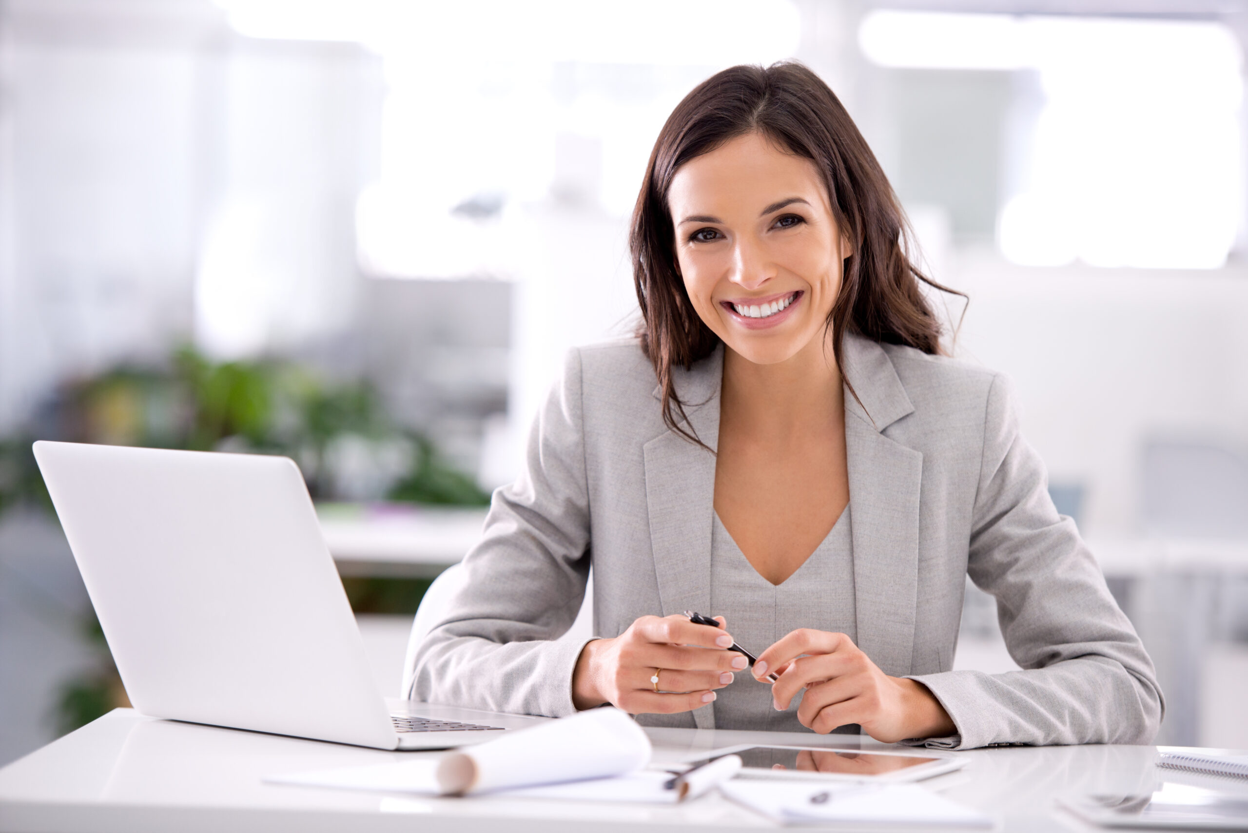 Shot of an attractive businesswoman sitting at her desk in an office